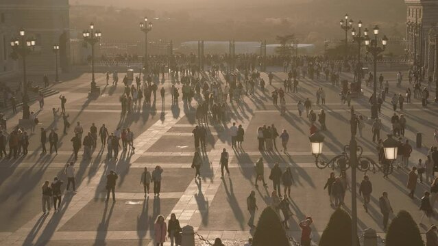 Crowd of People and Catedral de la Almudena during Sunset Madrid, Spain