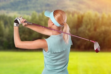 Golfer sporty woman hit golf ball