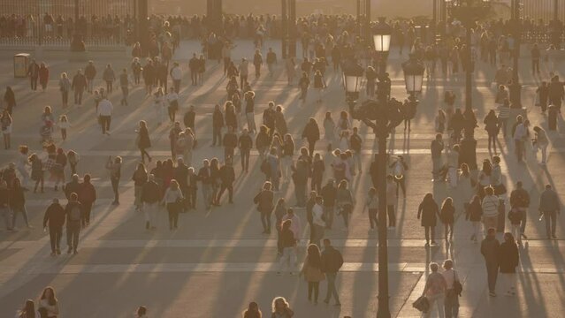 Crowd of People and Catedral de la Almudena during Sunset Madrid, Spain