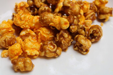 Crispy popcorn on wiite plate