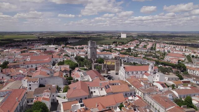 Establishing shot, cityscape of Beja in Portugal with Beja Castle, aerial view