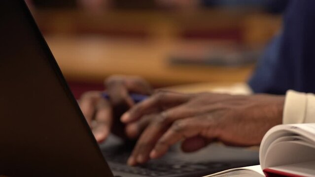 african american prisoner inmate in prison classroom on computer closer up hands 4k