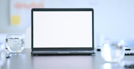 Laptop screen, mockup and boardroom of a tech company at a desk with digital presentation....