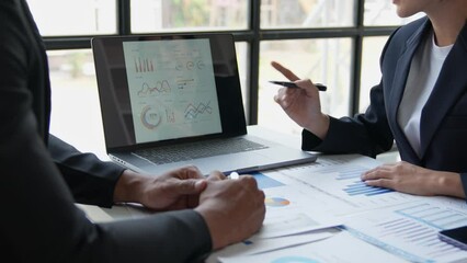 Asian entrepreneurs and businessmen meet in the office for business planning and financial budgets and assess investment risks To analyze customer groups to increase the growth of the company.