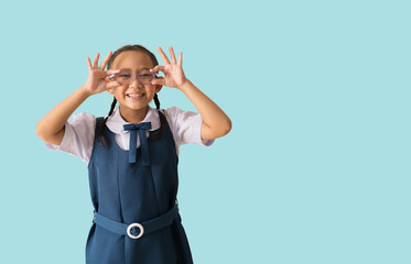 Portrait Happy smile asian school girl in uniform with backpack and hands holding glasses, isolated...
