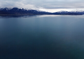 Aerial view of the beautiful North polar background. Landscape nature sea and mountains of Iceland. Photography for tourism background, design and advertising