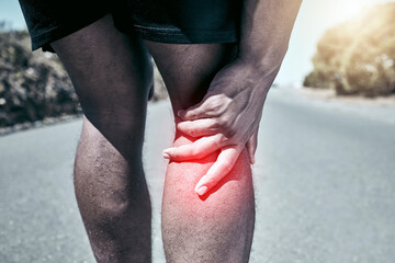 Athlete, pain and joint with closeup in the outdoor with exercise for sports injury from a workout.Training, road and knee injury with accident for fitness and medical emergency with leg for health.