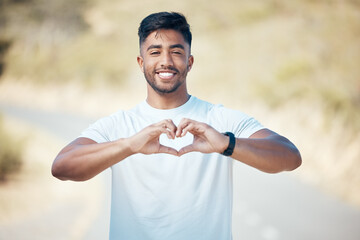 Happy man, fitness and portrait with heart hands in nature for cardio health or workout exercise outdoors. Fit, active or sport male person, athlete or runner with loving emoji and smile for training