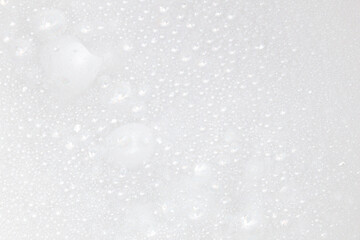 Soap bubbles.Abstract background white soapy foam texture.Shampoo foam with bubbles.Indoors shot.