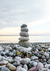 Stone tower on the beach. Cairn. Symbol of balance.

