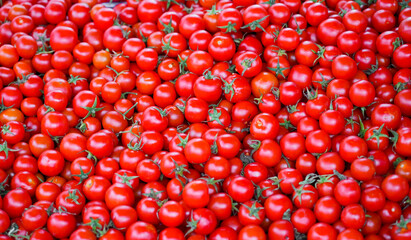 Fresh red tomatoes at a market. Vegetable background.
