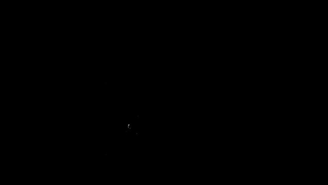 Slow motion of starting camp fire at night. Flames and naphtha lantern only as light source.