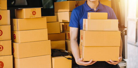 Business woman start up small business entrepreneur SME success .freelance woman working at home with Online Parcel delivery. SME and packaging deliveryconcept