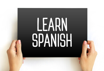 Learn Spanish text on card, concept background