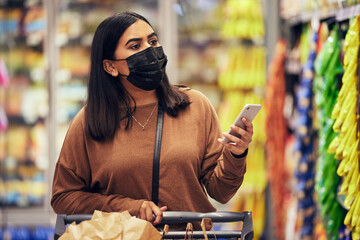 Woman, phone and grocery checklist in shopping for food, luxury or product with face mask at...