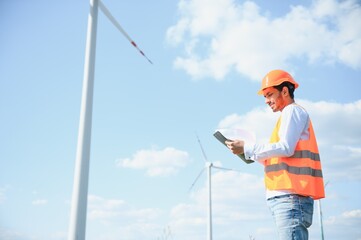 Obraz na płótnie Canvas Indian Windmill engineer inspection and progress check wind turbine.