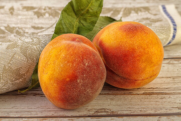 Two ripe sweet peaches fruit
