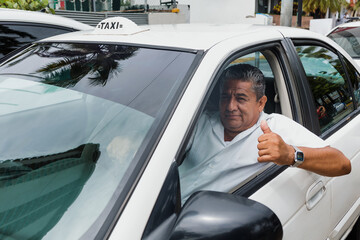 portrait of latin taxi driver senior man with car on background at city street in Mexico in Latin America, Hispanic adult people