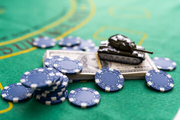 Poker chips and banknotes on table in casino