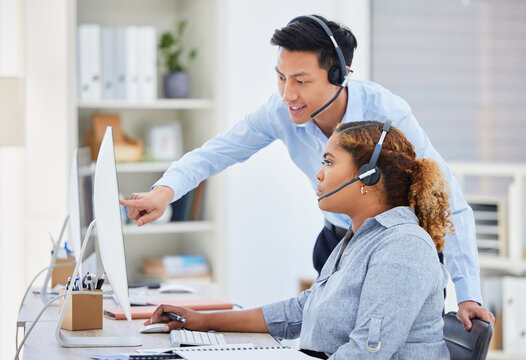 Call center, training and manager with woman on computer for help, advice and assistance. Telemarketing, customer support and female intern with Asian man boss for contact, crm service and consulting