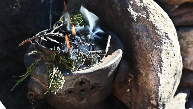 Juniper wood while burning. Nepal people used it for the ritual purification of temples. The ancients believed the smoke aided clairvoyance.