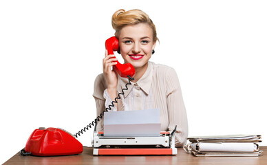 Fototapeta premium Retro woman working in office with vintage typewriter and phone, dressed in pin-up style