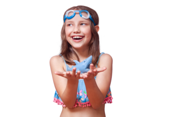 a girl in goggles for swimming and a blue swimsuit holds a toy shark and rejoices laughs near the pool of the river sea water on a white background isolate
