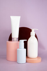 Display of cosmetic bottle on pink podium mockup