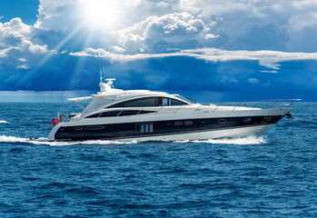 White and blue luxury motor boat (yacht) moving on the Mediterranean sea with beautiful storm...