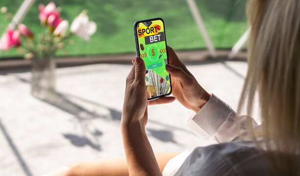 smartphone against gambling app screen - Powered by Adobe