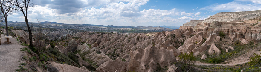 Fototapeta na wymiar Large panoramic view of Love Valley - a valley in Goreme Historical National Park, Cappadocia, Turkey