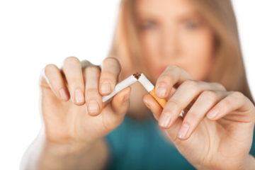 A woman breaking a cigarette, Stop smoking concept