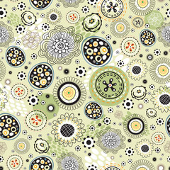 Seamless bright abstract pattern on a green background with black and white elements, and flowers