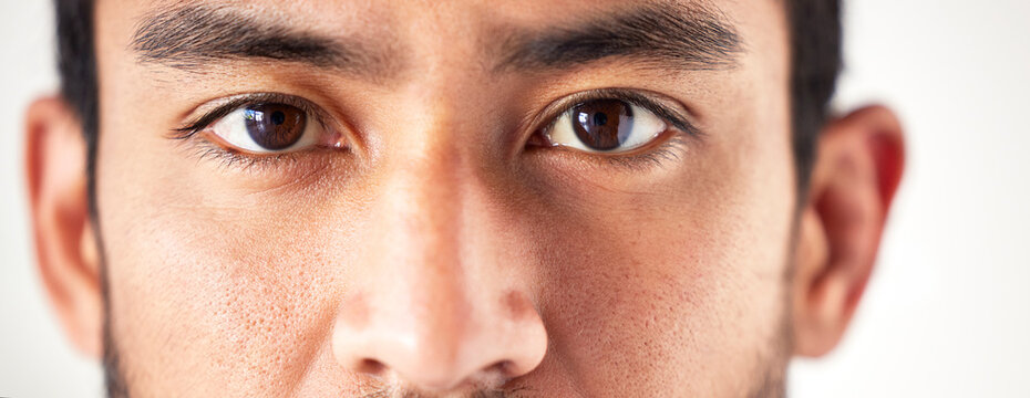 Closeup, portrait and man with eyes, vision and looking forward with sight, see and clear optics. Face, male person or model with eyesight, zoom or eyecare with health, wellness or staring with focus