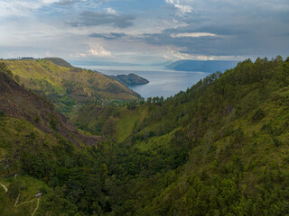 Obraz premium Lake Toba among the mountains with tropical vegetation. Sumatra, Indonesia.