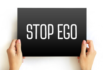 Stop Ego text on card, concept background