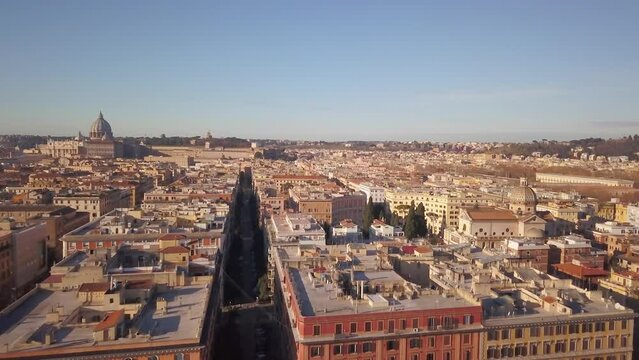 Aerial Cinematic drone downtown  Piazza Rome Italy birds flying past buildings, cars, traffic and streets of Vatican City St Peters Europe Sistine Chapel square morning back slowly movement