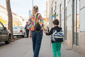 mother and son go to school