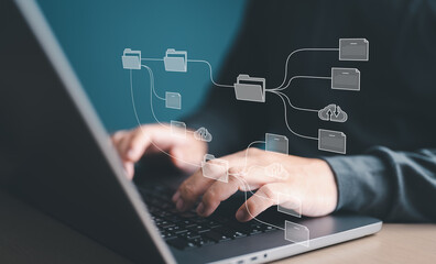 Document Management System (DMS) with arrange folder and files icons. Man setup storage backup online application on computer laptop. Software for archiving, searching, managing files and information.