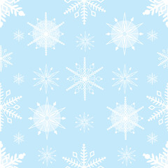 Fototapeta na wymiar A seamless pattern comprised of stylized, white snowflakes, over a pale blue background.
