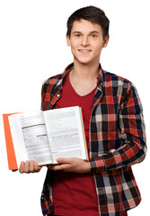 Young man holding open a textbook