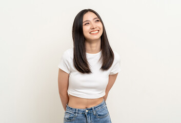 Beautiful young asian woman in white shirt. Charming female lady standing pose thinking on isolated white blank background. Asian cute people looking copy space for text advertise