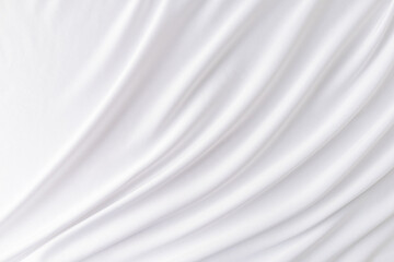 Obraz premium Elegant soft waves of white satin fabric. Abstract wedding background. The concept of the layout of the wedding design.