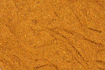 Pile of cajun powder as background, spice or seasoning as background. Close-up cajun powder