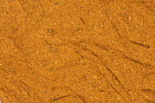 Pile of cajun powder as background, spice or seasoning as background. Close-up cajun powder