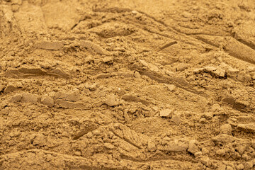 Pile of allspice powder as background, spice or seasoning as background. Close-up of Allspice powder in a wooden spoon. Pimento spice, Jamaican pepper and shavings