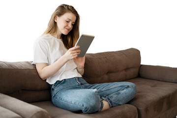 A woman uses a tablet at home on the sofa online shopping on the Internet. Transparent background, isolated.