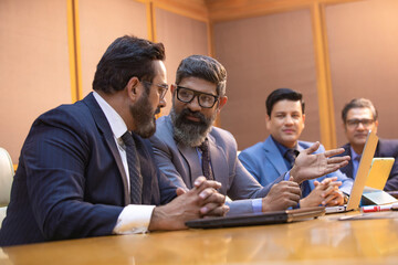 Businesspeople attending conference meeting in modern office.