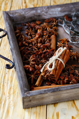 Cinnamon and anise spice in wooden tray