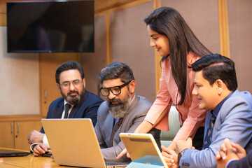 Businesspeople attending conference meeting in modern office.